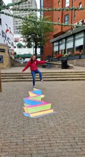 woman walking on an outdoor floor marketing sticker