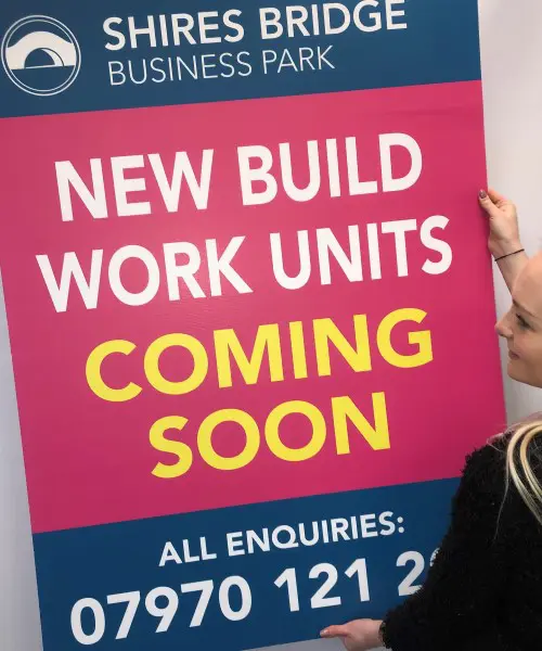 pink day glo correx sign advertising new build properties coming soon ready for displaying