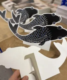 Die cut strutted fish standee cards