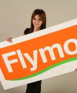 woman holding a Flymo logo sign board