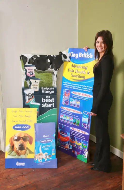 woman standing with custom printed show cards