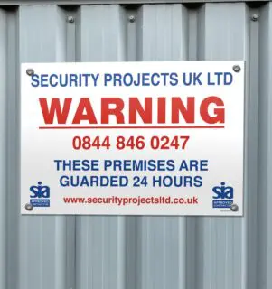 warning board on metal container