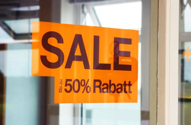50% sale window sticker printed in day glo orange for stand out promotions