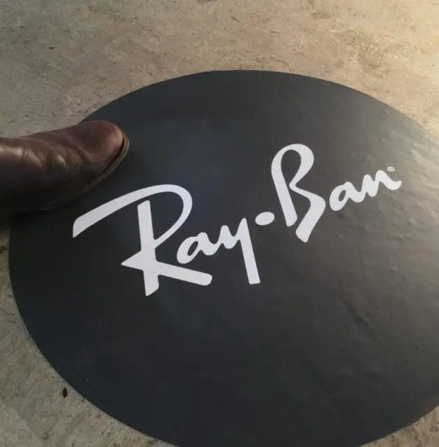 Ray-Ban round floor sticker for indoor use on concrete warehouse flooring with anti slip laminate