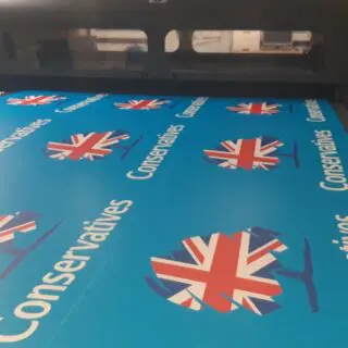 Conservative campaign boards on a printer