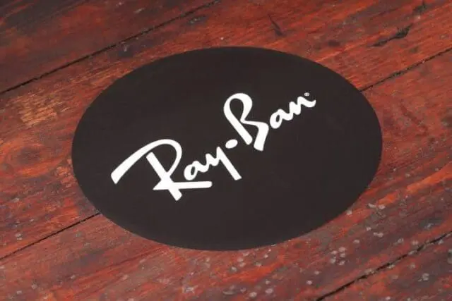 Indoor and outdoor floor stickers printed with company logo and cut to shape, then displayed on a wooden floor