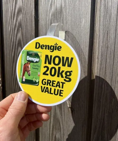 Shelf wobbler advertising disc fitted with a wobbler arm so it can move in the breeze