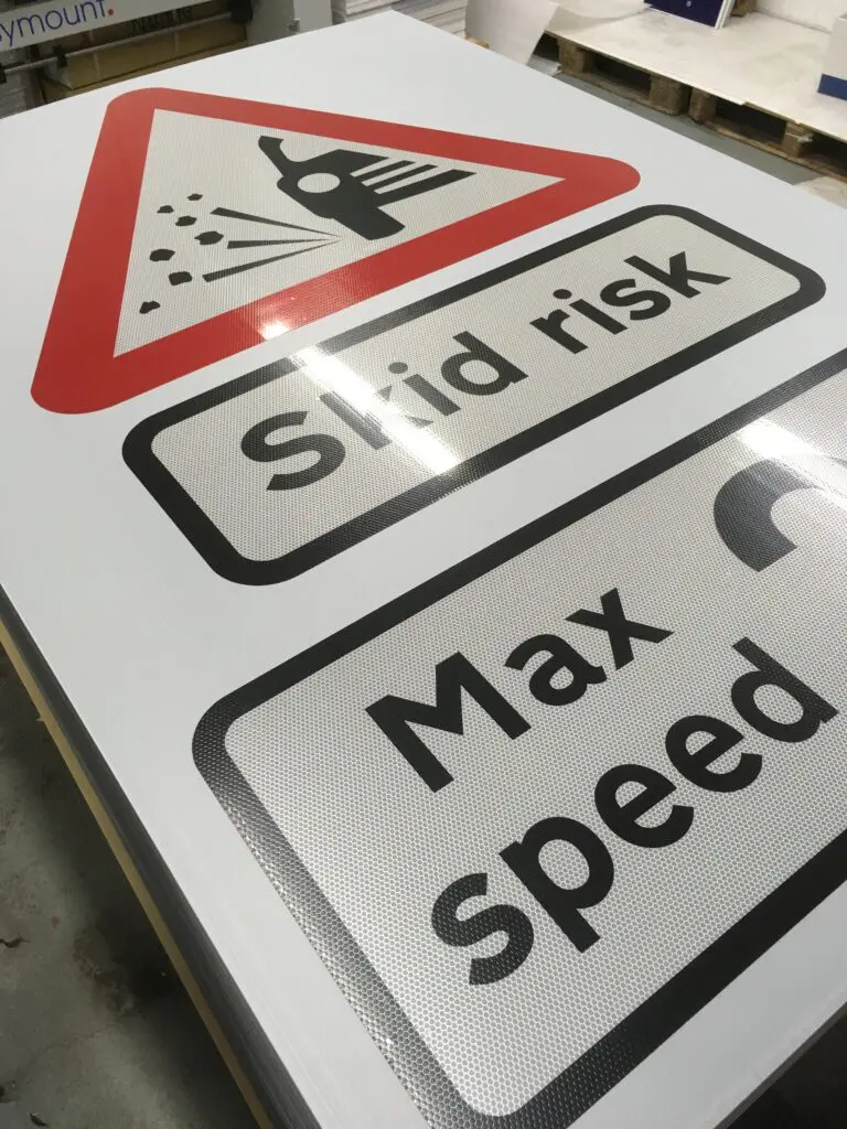 skid risk max speed 20mph surface dressing sign