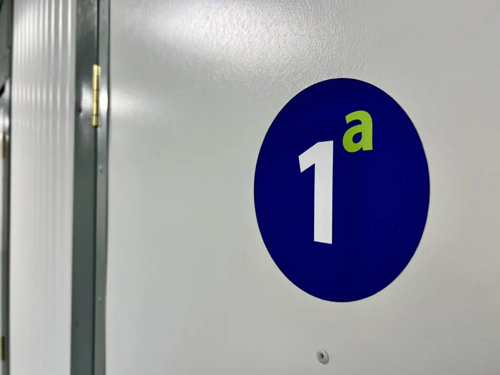 Custom self storage unit number stickers fitted to indoor storage unit doors