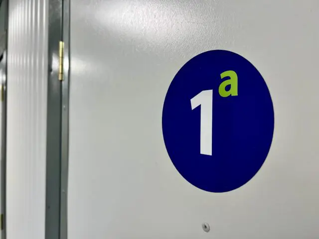 Custom self storage unit number stickers fitted to indoor storage unit doors