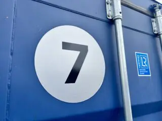 High tack vinyl number stickers for outdoor self storage containers and painted metal doors
