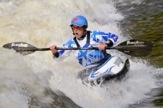 kayaker with waterproof vinyl stickers on paddle