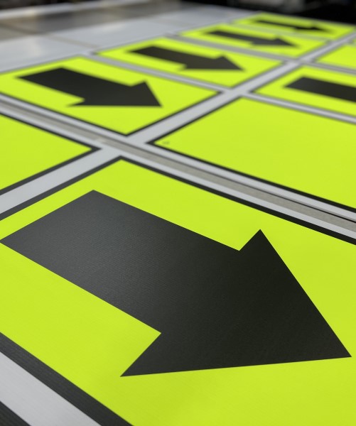 Fluorescent day glo race arrow signs