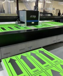 Green day glo directional arrow signs