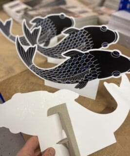 Die cut strutted fish standee cards