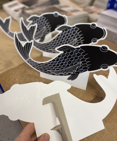 Die cut strutted fish standee cards