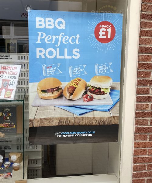 Waterproof posters for use in window displays