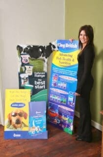 woman standing with custom printed show cards