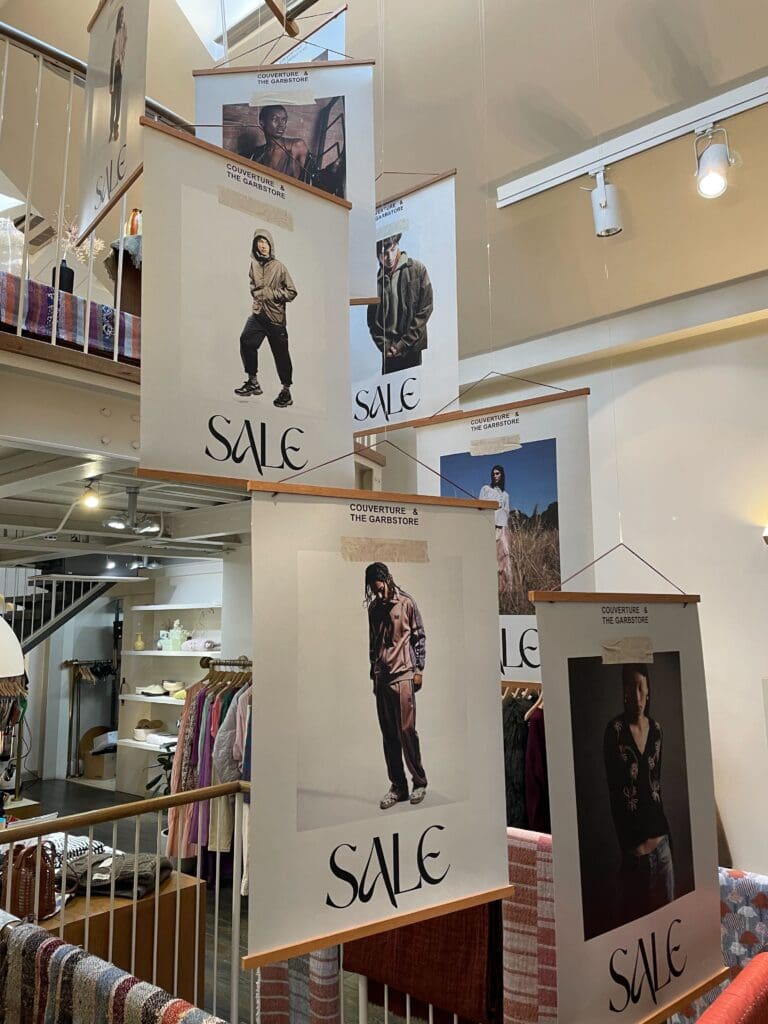 A1 posters hanging in a clothing shop