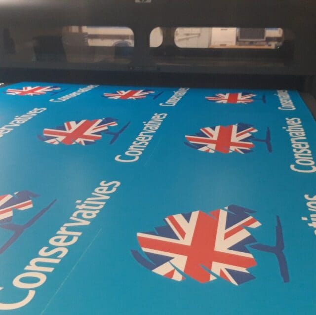 Conservative campaign boards on a printer