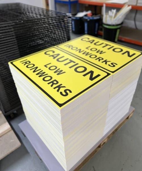Caution low ironworks temporary road sign printed in a factory on Correx sheets