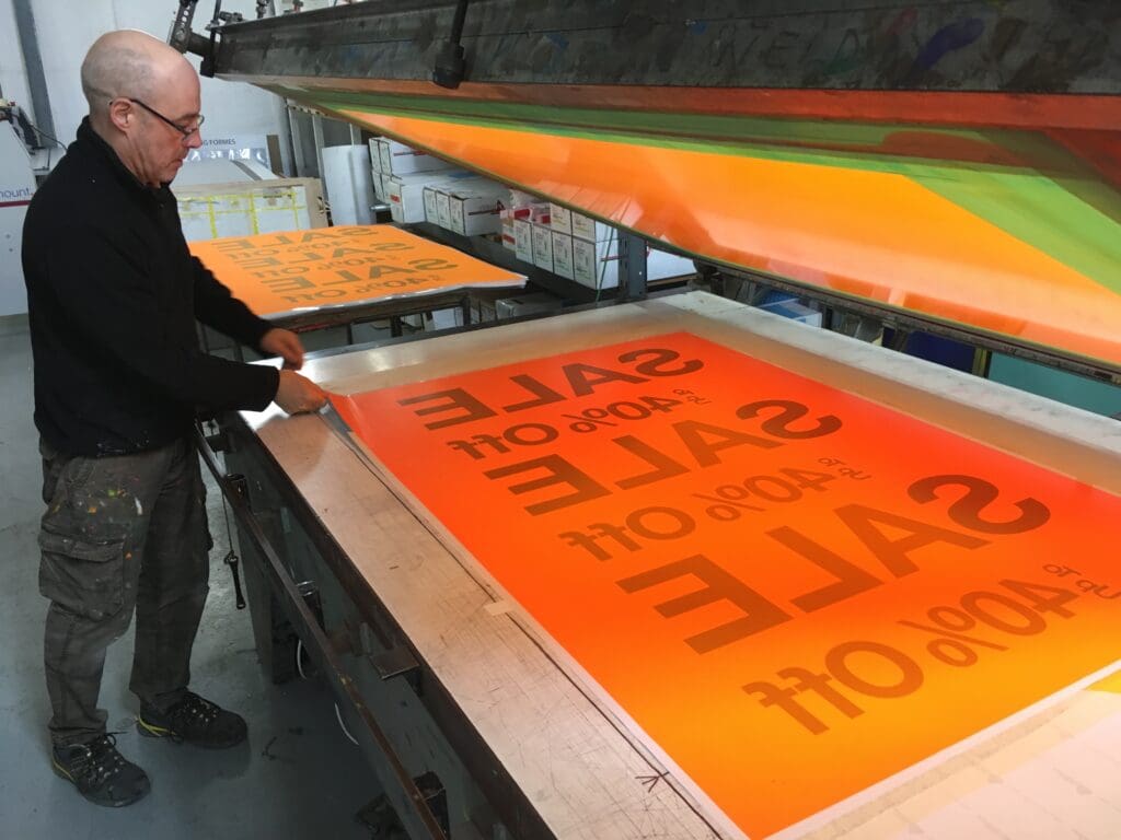 Screenprinted day glo signs and stickers