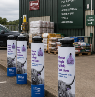 custom printed branded boallard covers used outside a warehouse country store